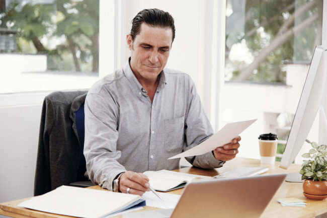 Business owner completing a yearly business insurance review