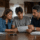 Parents reviewing family auto insurance options with a teen driver