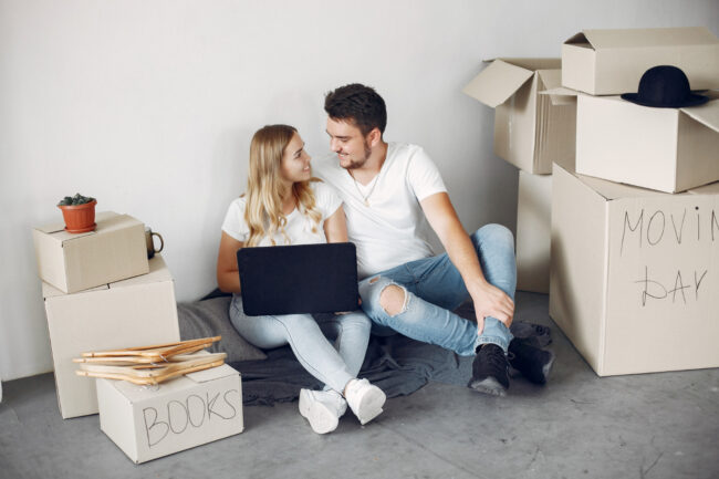 image-insurance-updates-before-moving Homeowners reviewing insurance updates before moving to a new address